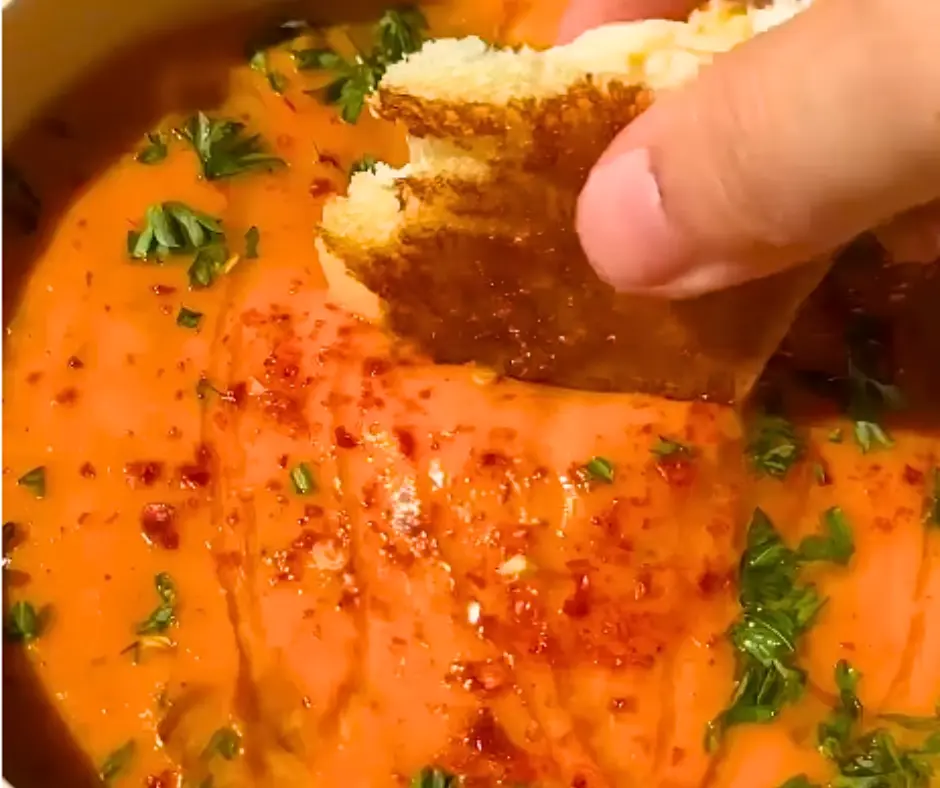 Comforting Tomato Soup with Crushed Saltines and Butter